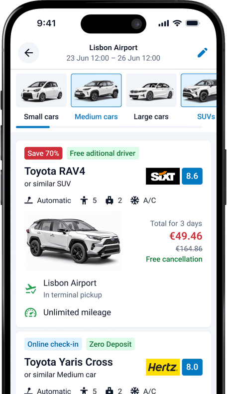 The DiscoverCars.com app opened with the search results for a medium car at Lisbon Airport showing